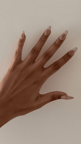 Taylor after applying the Salon Perfect Artificial PressOn Nails in Magnetic Silver